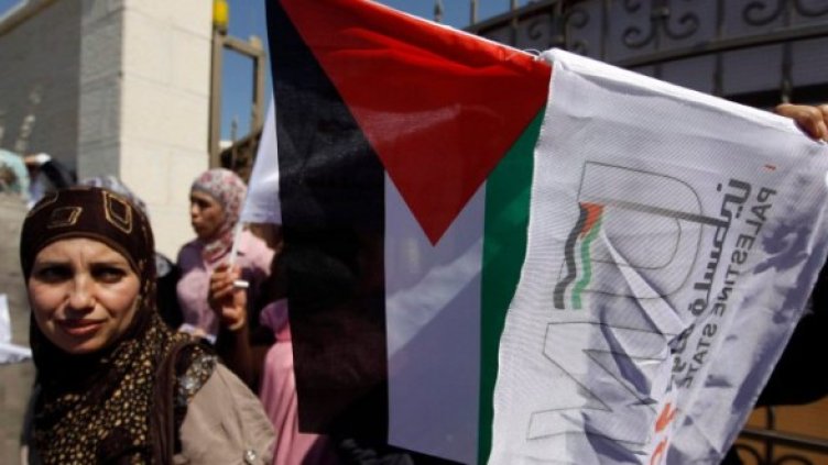Палестинка участва в демонстрация на Западния бряг с искане за пълноправно палестинско членство в ООН. Снимка: Reuters