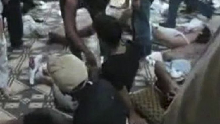 Тела на убити в село Мазраат ал Кабир. Снимка: Reuters