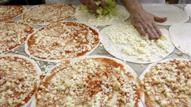 В Китай пицата не е сред популярните ястия, но Казим бързо се научил да готви италианска кухня. Снимка: Reuters