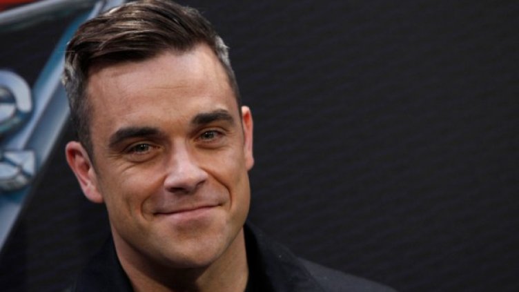 Роби Уилямс се радва на дъщеря. Снимка: Reuters