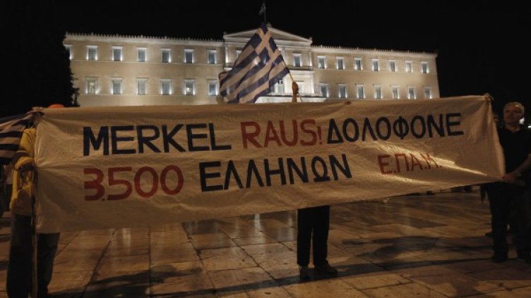 Протест срещу посещението на Меркел в Атина. Снимка: Reuters