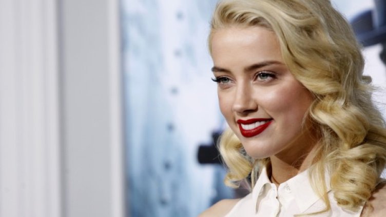 Актрисата Амбър Хърд успя да омагьоса с чар и усмивка дори женения Джони Деп. Снимка: архив Reuters