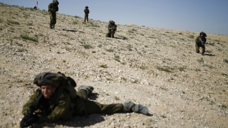 Израелски резервисти на учението близо до кибуца Ревивим. Снимка: Reuters