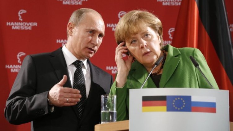 Владимир Путин и Ангела Меркел. Снимка: Reuters