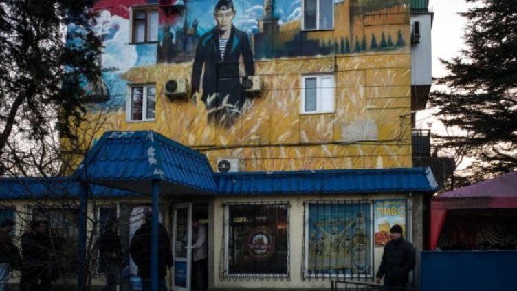 Графит в Севастопол след анексирането на Крим, изобразяващ руския президент Владимир Путин. Снимка: Bloomberg