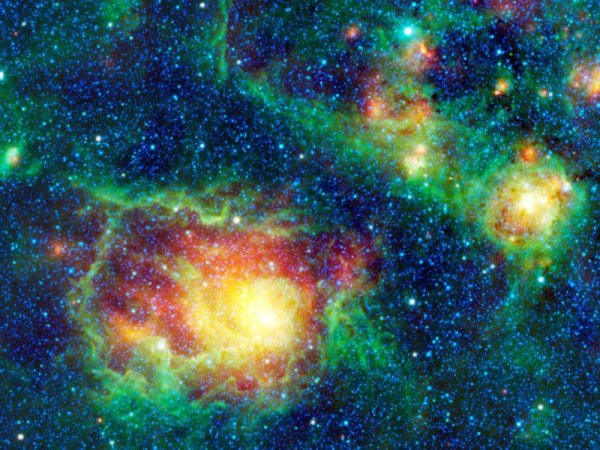 Мъглявината Лагуна, известна също като Messier 8, или просто M8, се вижда като голям кръгъл облак, заобиколен от безброй звезди. Снимка: NASA/JPL-Caltech/UCLA