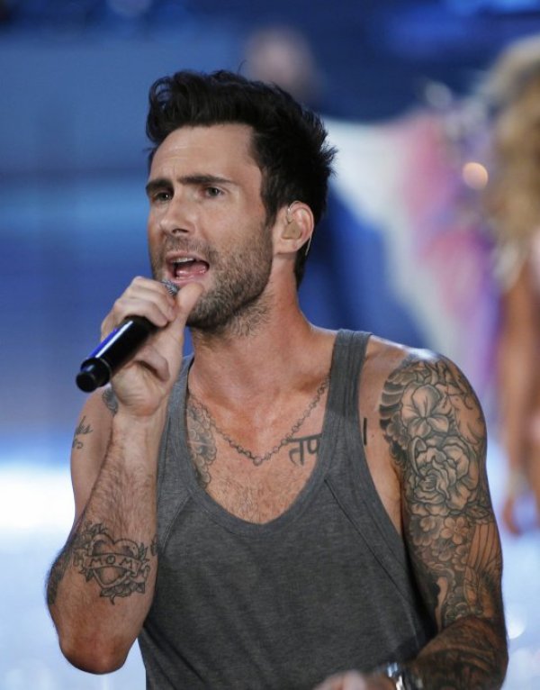 Адам Лавин:&nbsp;вокалистът на Maroon 5 оглави класацията на списание People за най-сексапилен мъж през 2013г. Той наскоро се раздели с руския супермодел Анна Вялицина. Снимка: Reuters&nbsp;