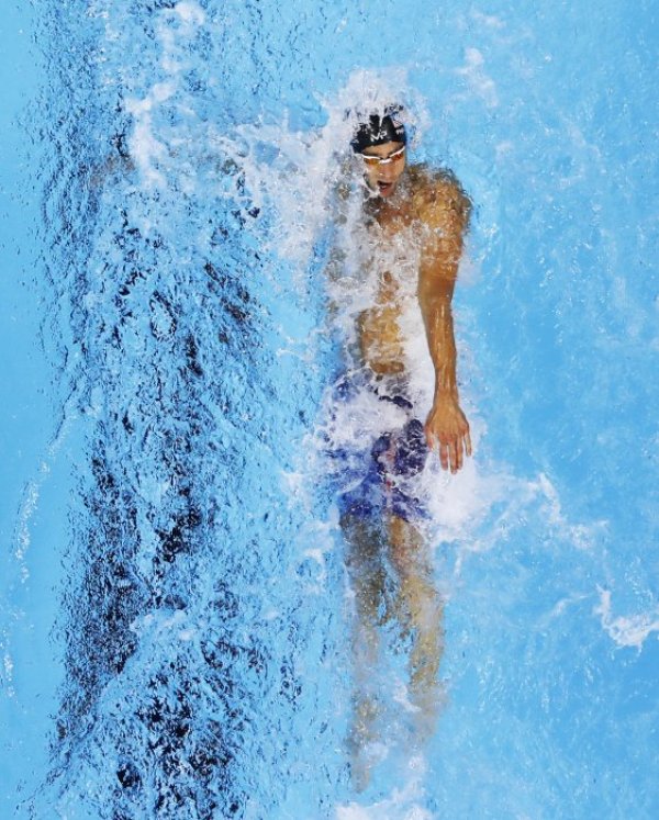 Майкъл Фелпс в момент от своето плуване по време на полуфиналите на 200 метра съчетано плуване от олимпийските игри в Рио. Снимка: БТА